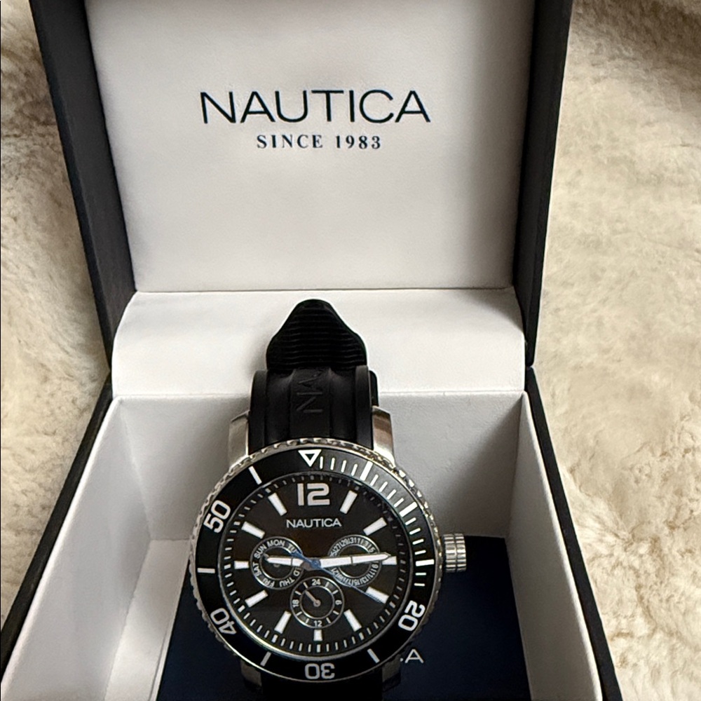 Good condition some scratches back Nautica Black and Silver Chronograph Watch
